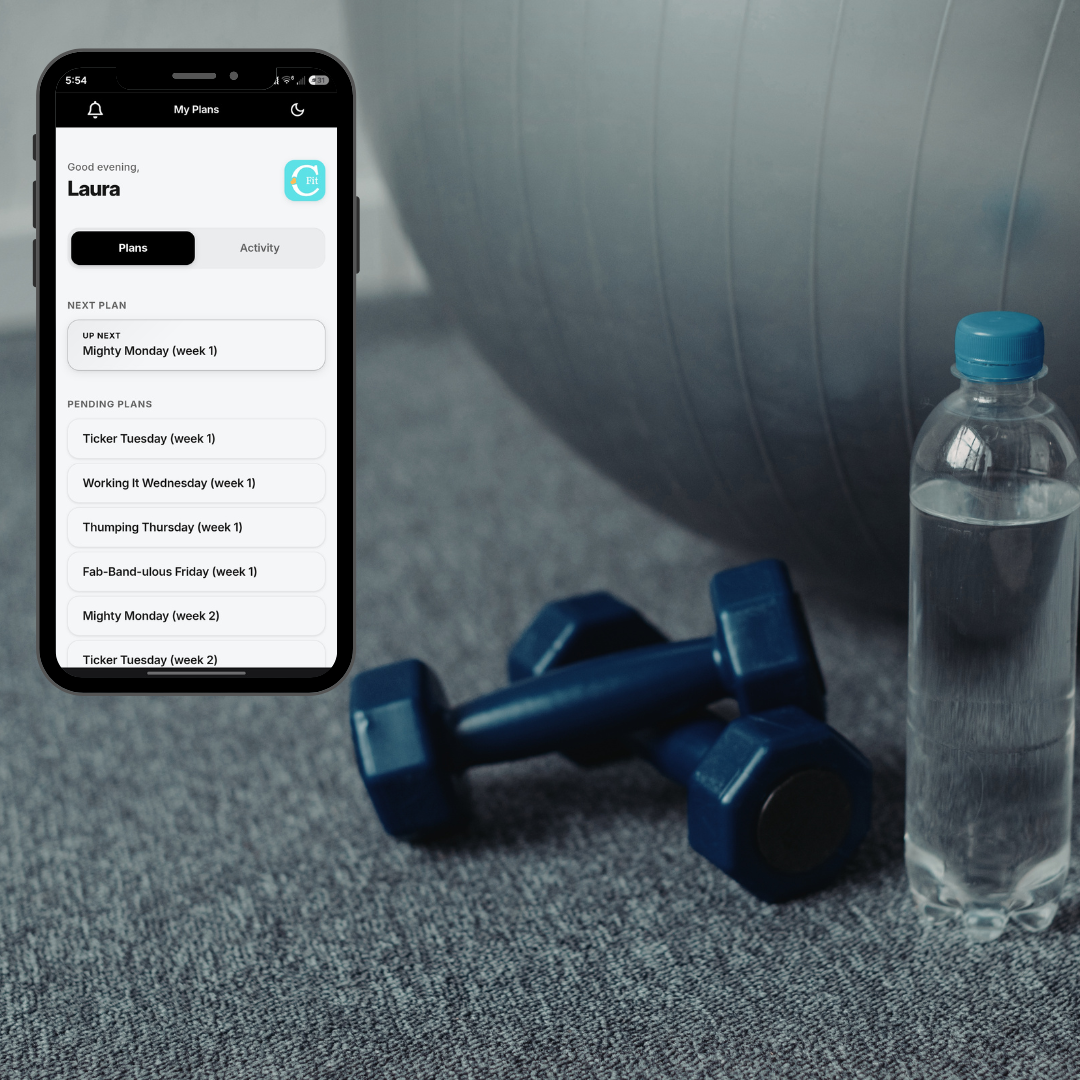 A smartphone displaying the C-Fit fitness training app next to a water bottle and blue dumbbells on a gym floor.