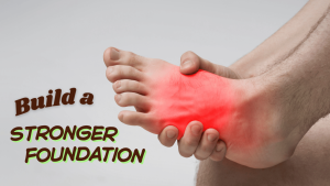 Close-up of a person sitting on the floor holding a sore foot, highlighting heel and arch pain from plantar fasciitis.